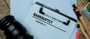 Form on clipboard with gavel on it that says Bankruptcy Chapter 13